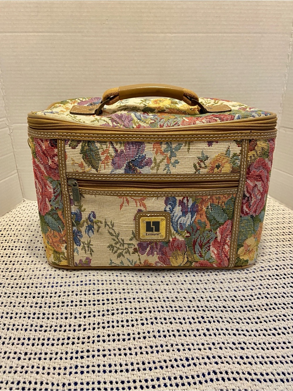 Vintage Leisure Luggage train case features a floral pattern colorful tapestry